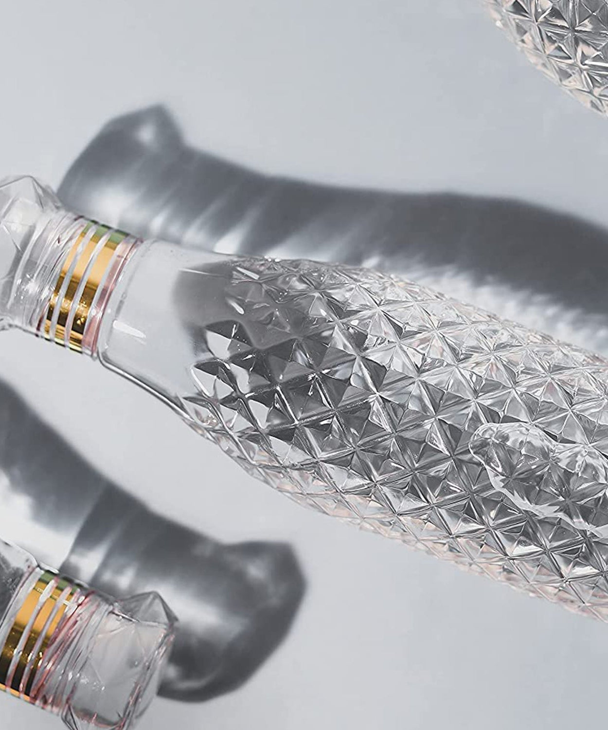 Stylish water bottle with diamond cut pattern