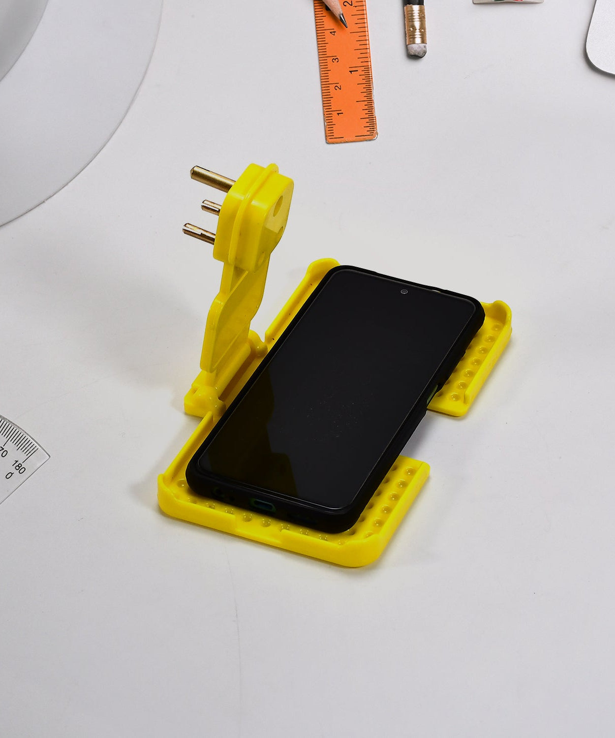 Multi-purpose charging holder for wall socket.