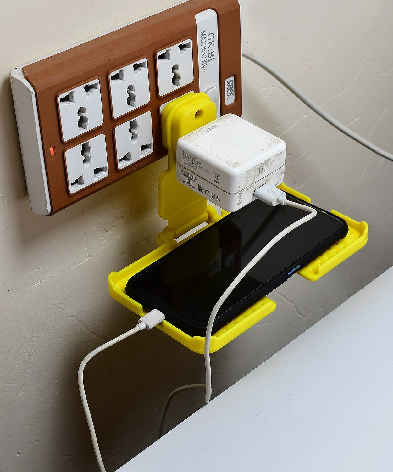 Wall holder stand for charging mobile.