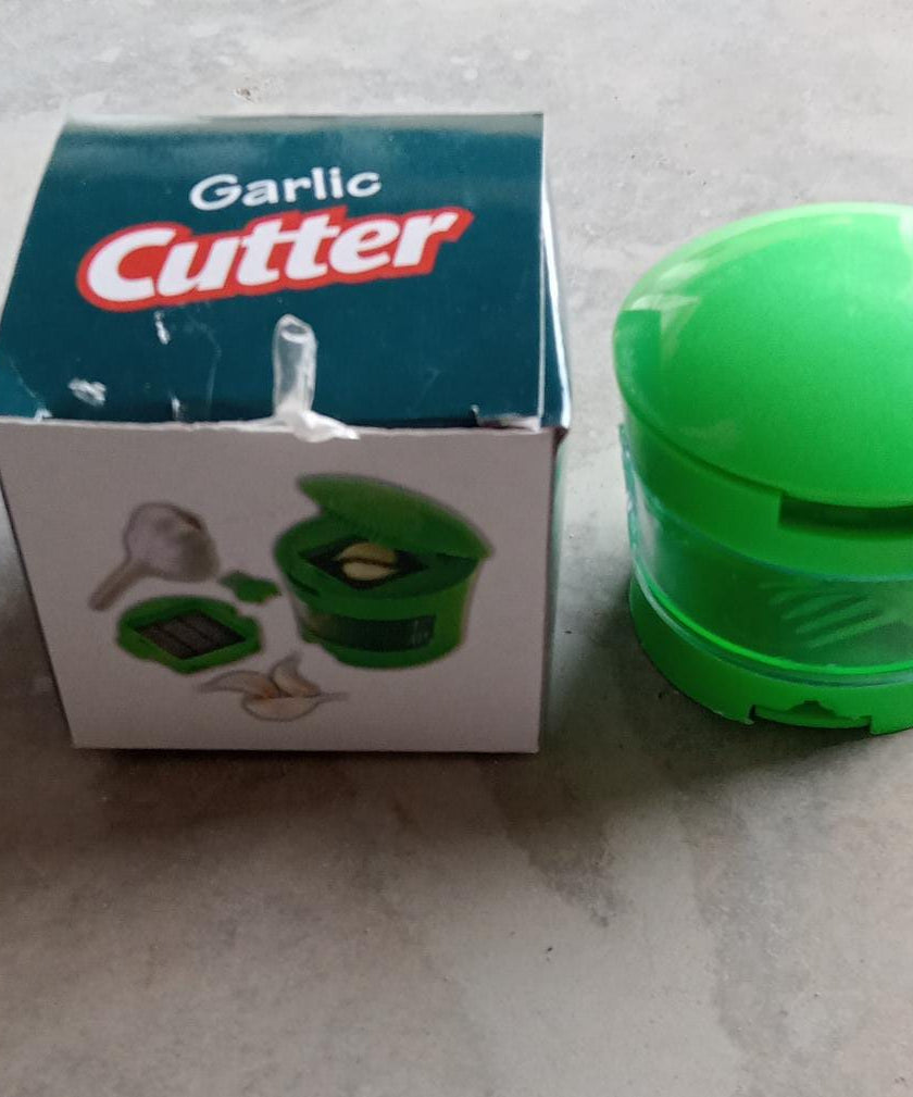 Garlic and ginger crusher with a container