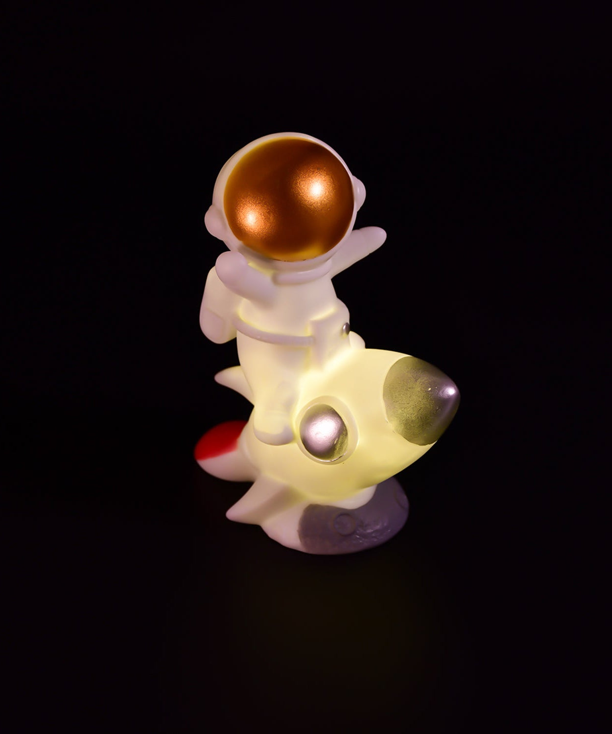 Astronaut figurine resin craft for desk ornament.