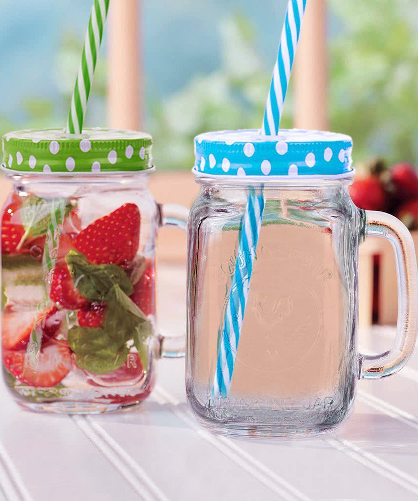 Drinking jar with handle and straw, suitable for smoothies and cold drinks.
