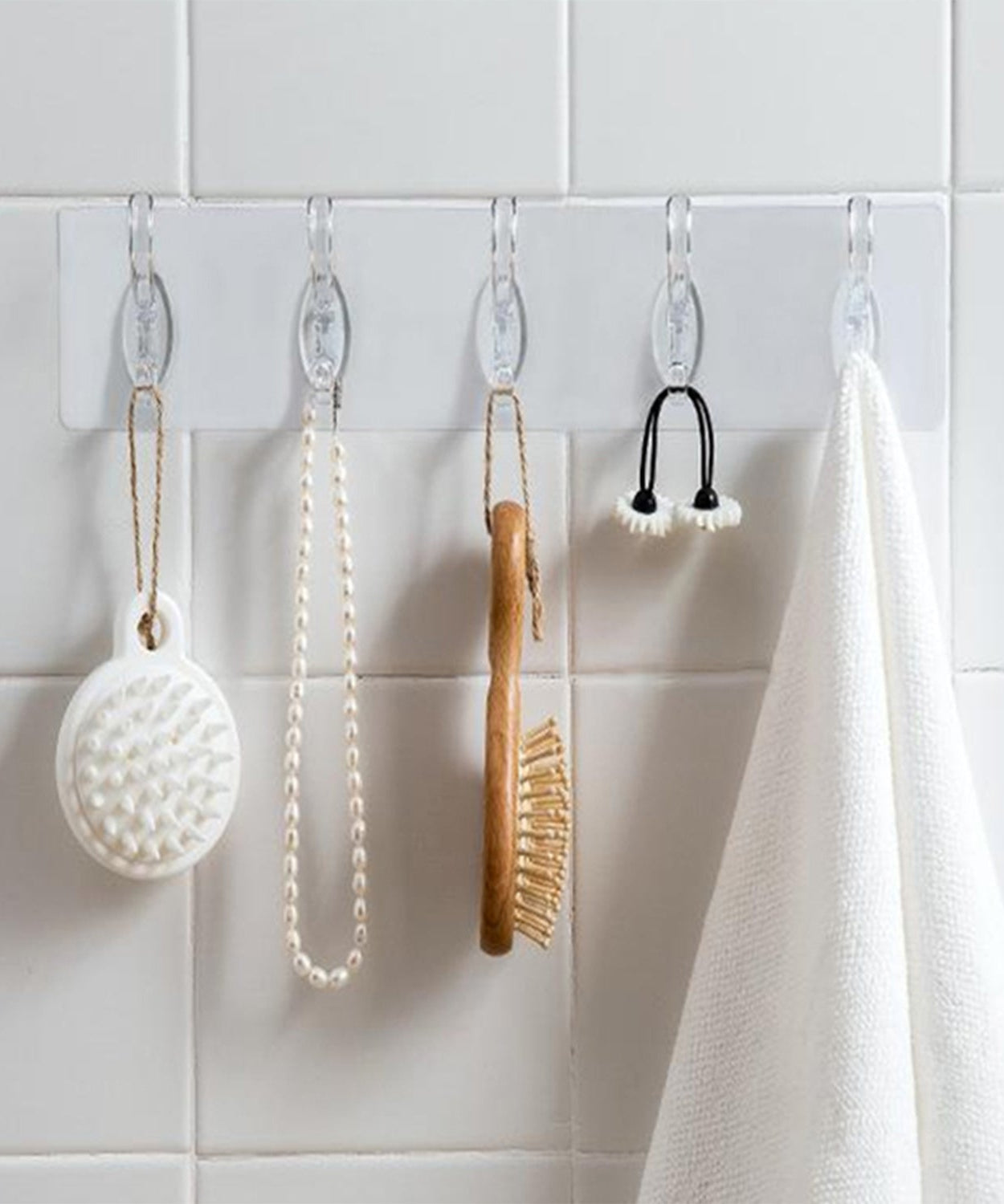 Heavy-duty transparent wall hook, adhesive-backed