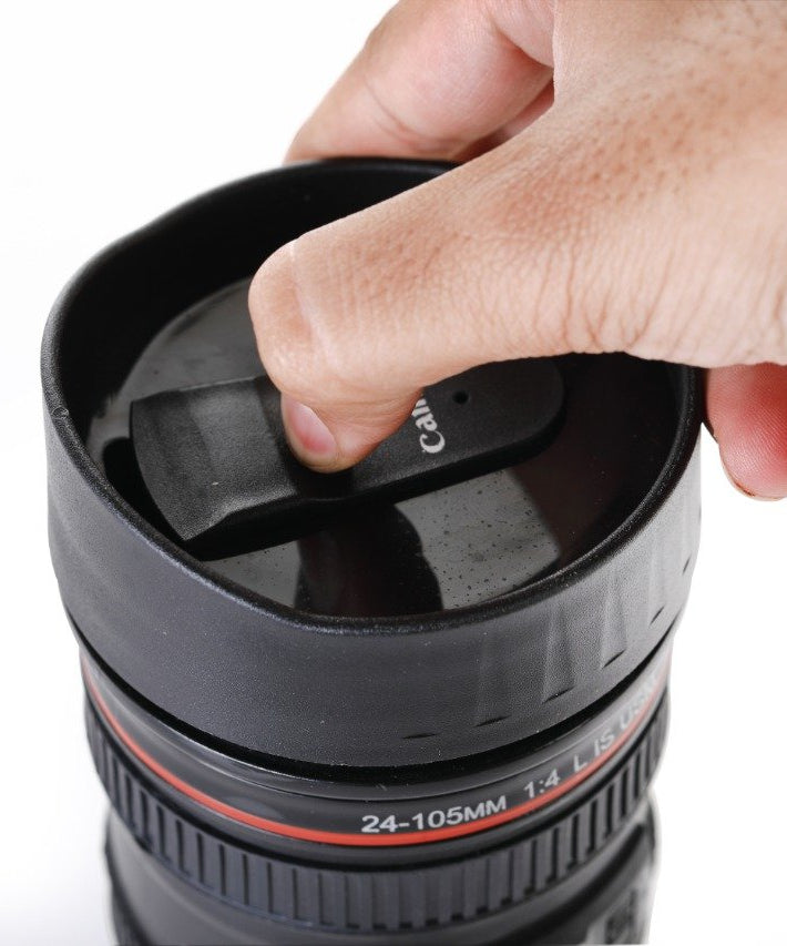 Coffee mug designed as a camera lens, with a secure lid