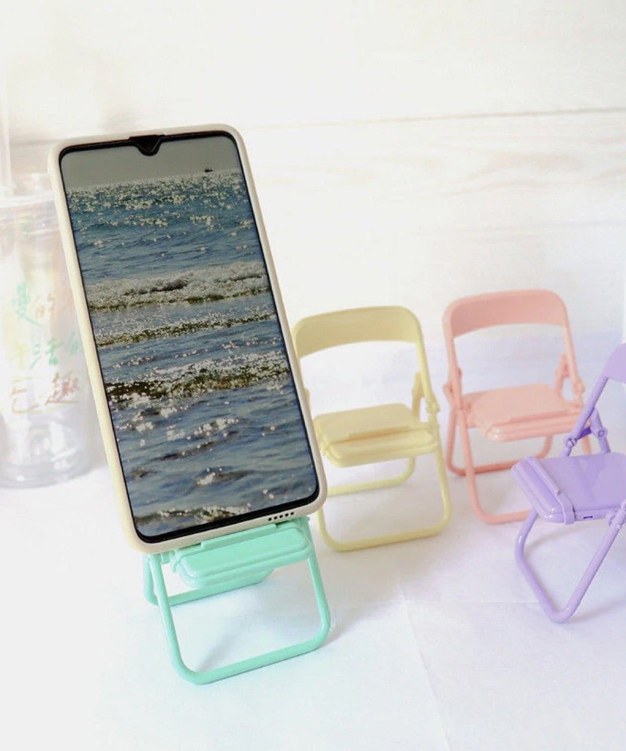 Phone holder stand in chair shape
