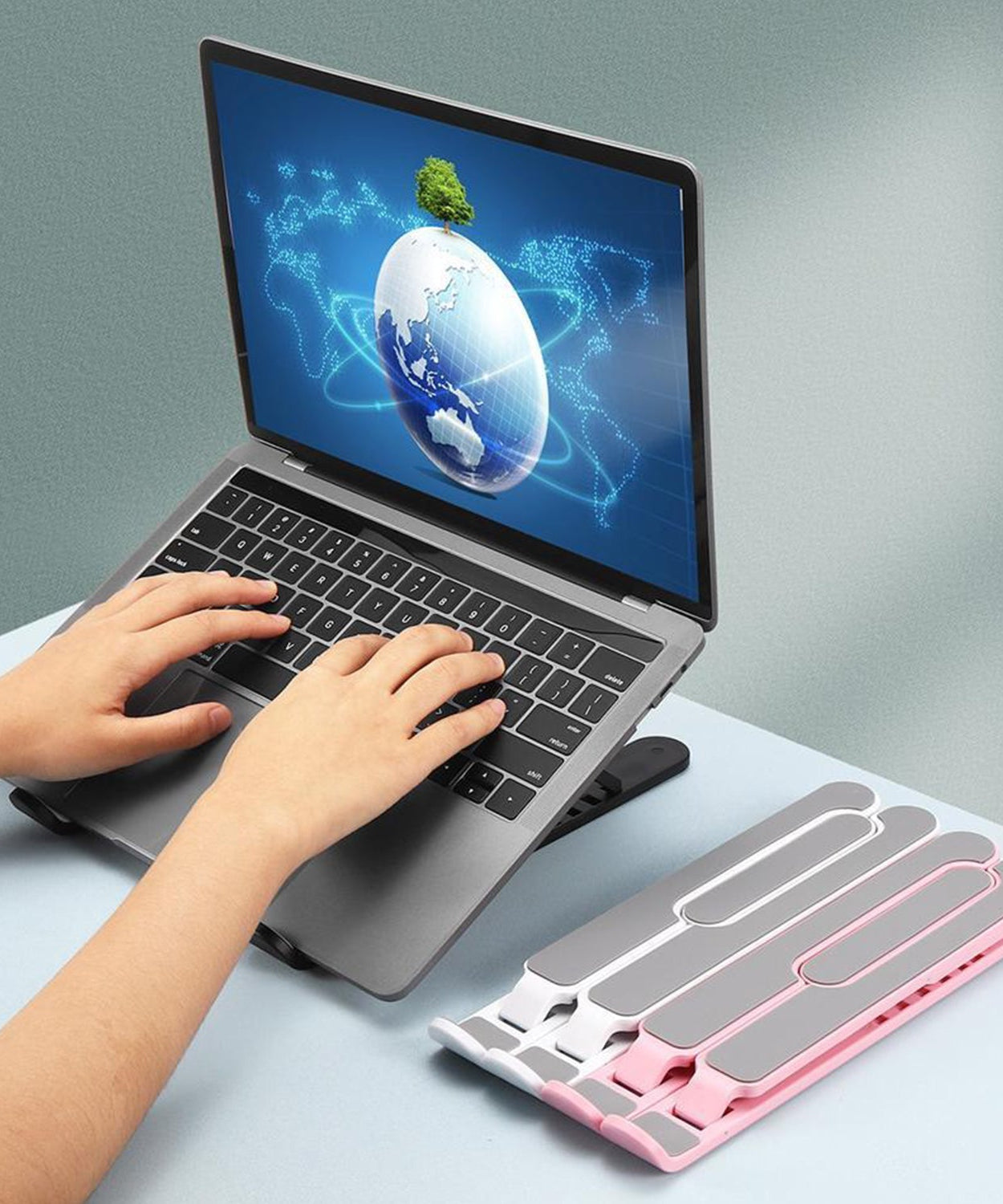 Portable laptop stand with height adjustment feature