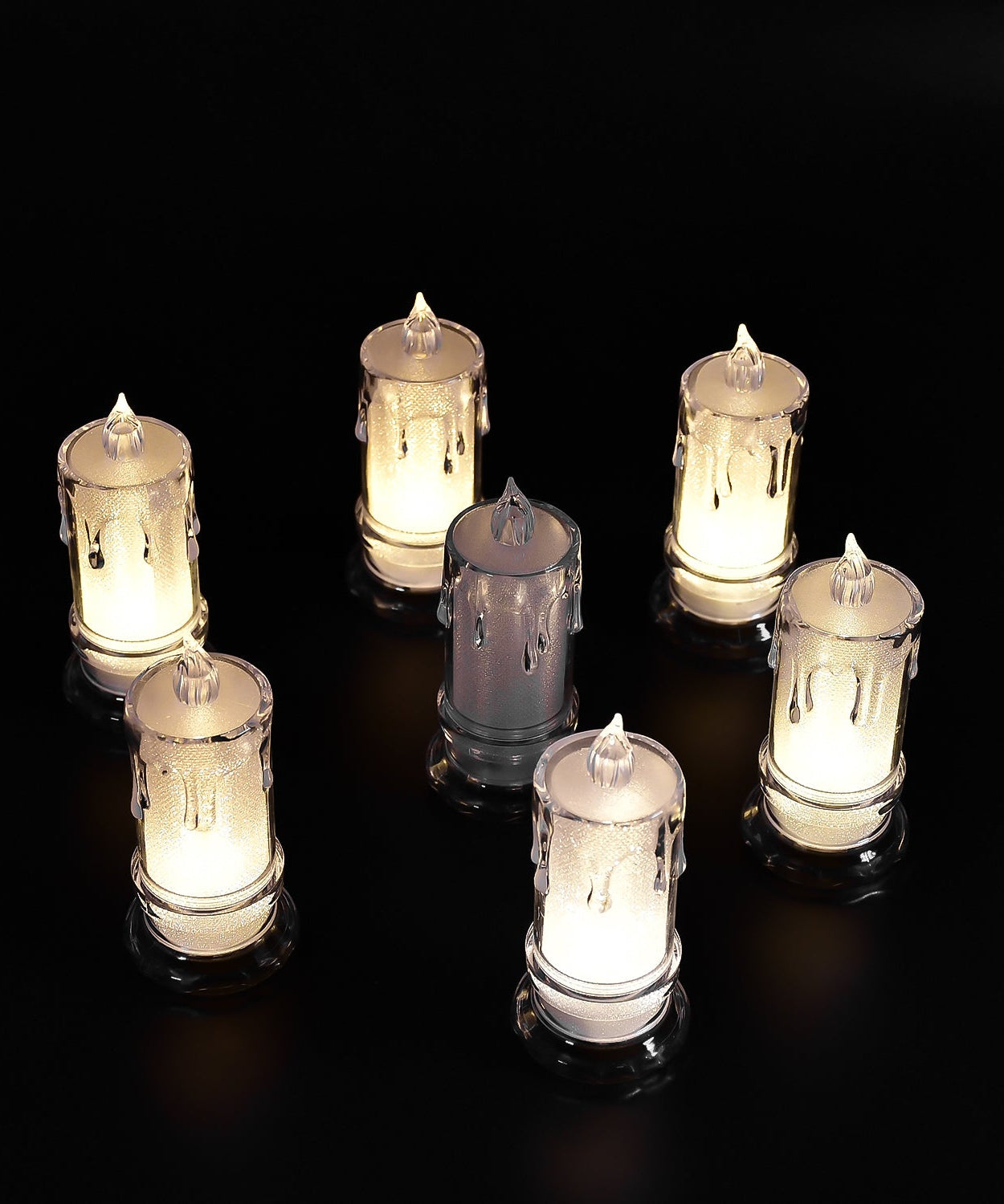 Large flameless candles with a melted design.