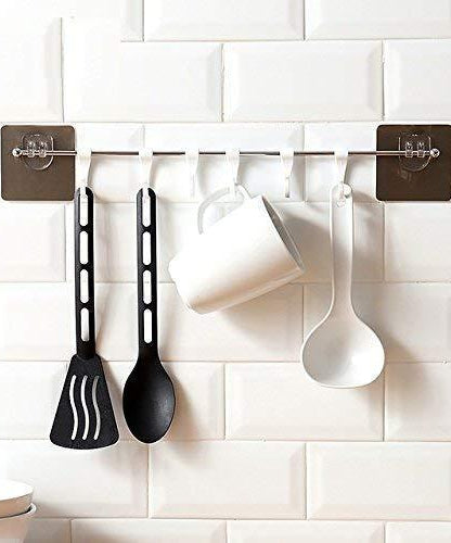 Multipurpose self-adhesive hooks, plastic, suitable for home use.