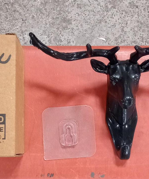 Deer head hook with self-adhesive backing for convenient hanging