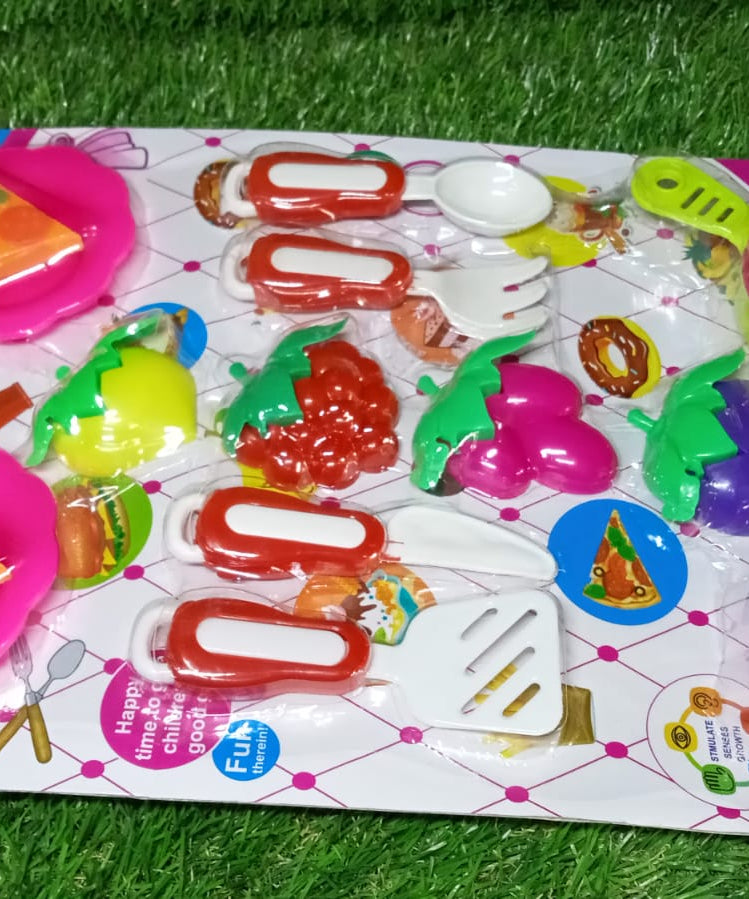 Toy kitchen set with utensils and dishes