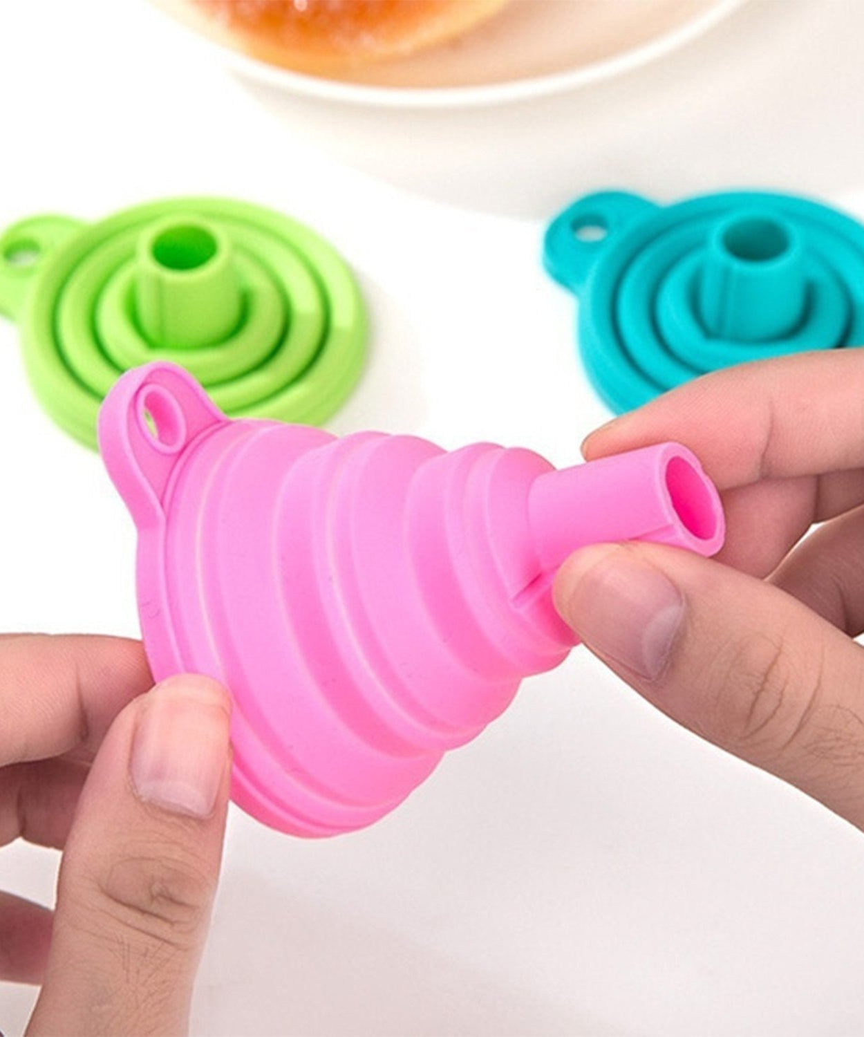 Silicone funnel for pouring liquids.
