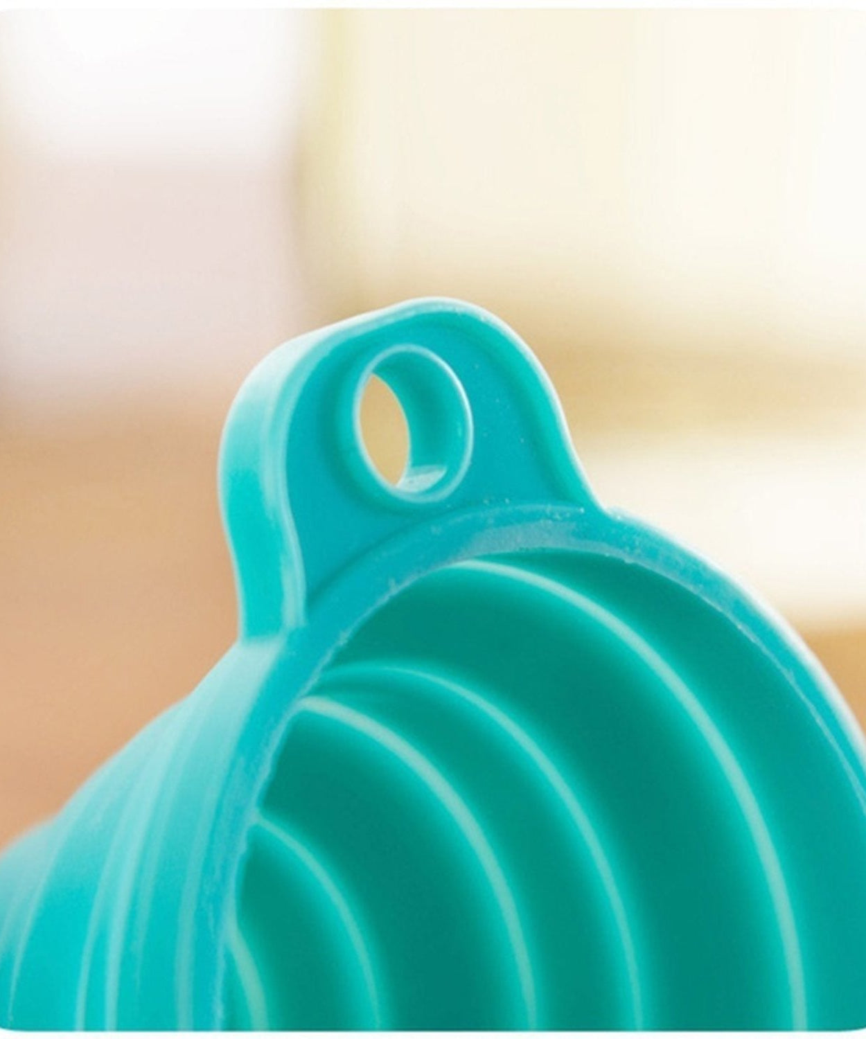Close-up of silicone funnel for pouring.