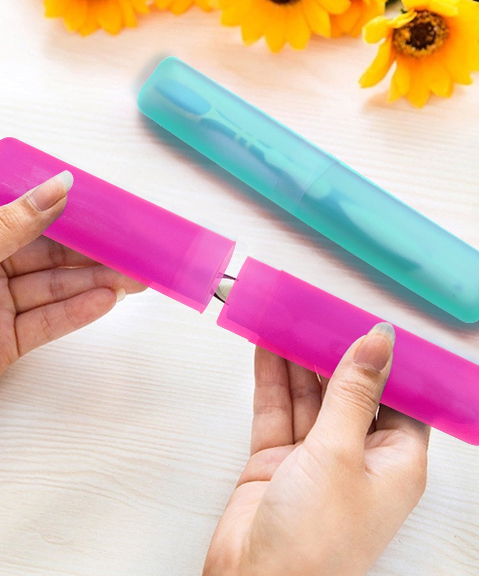 Set of four portable toothbrush cases.