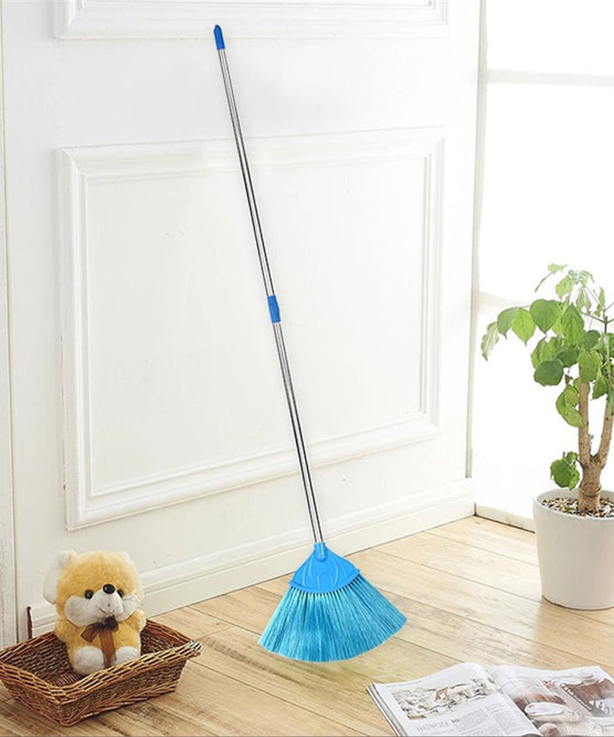 Ceiling broom fan shown in use for cleaning and dusting floor surfaces effectively.