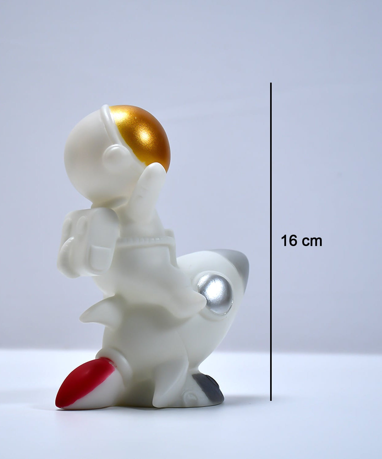 Space-themed astronaut model for office decor.