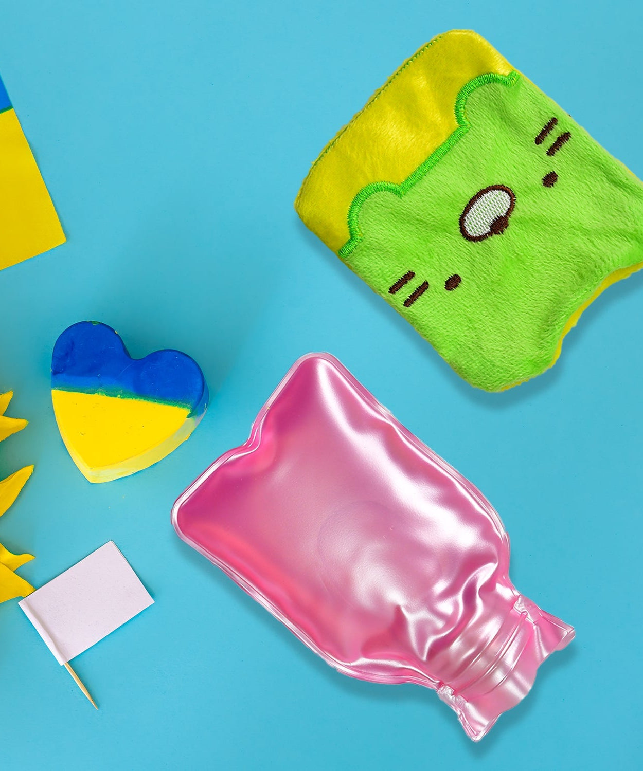 Green Kitty hot water bag with cover for pain relief and warming