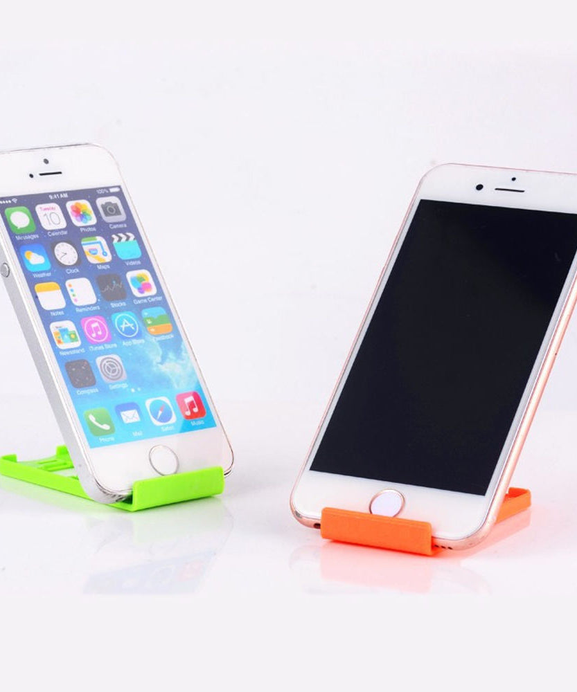 Universal phone holder stand that is portable and foldable.