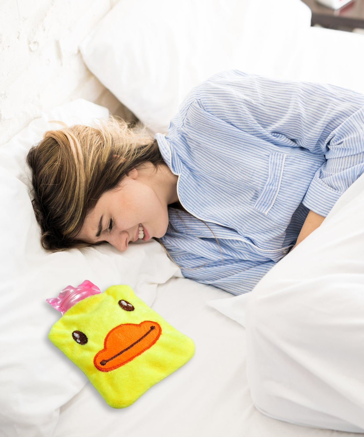 Hot water bag with a cute yellow duck cover for pain relief and warming
