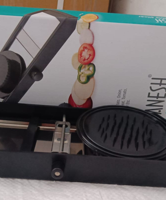 Ganesh adjustable plastic slicer, 1 piece, black and silver color.