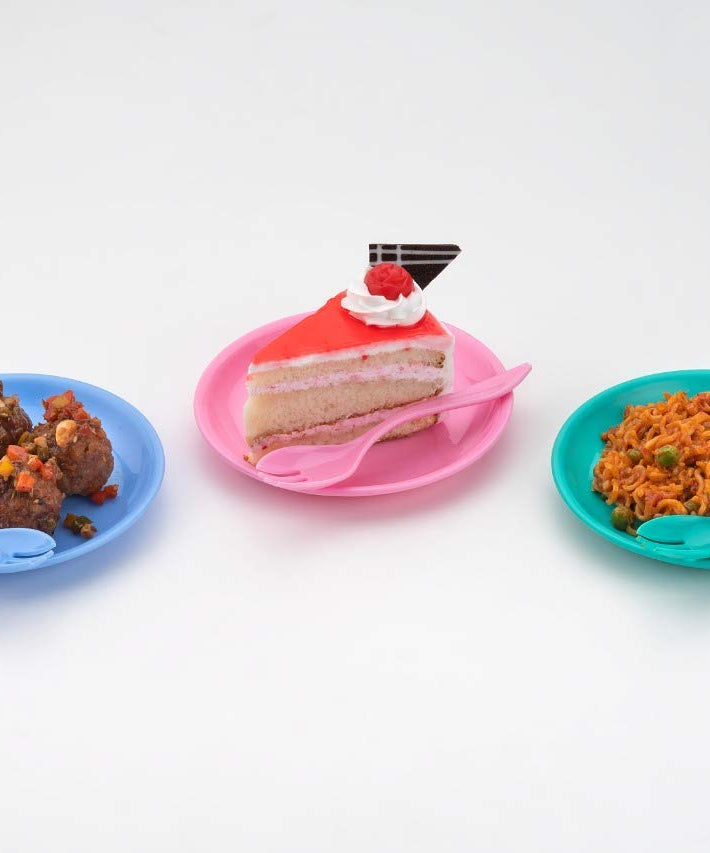 Snack set featuring a bowl, dish, and spoon in use.