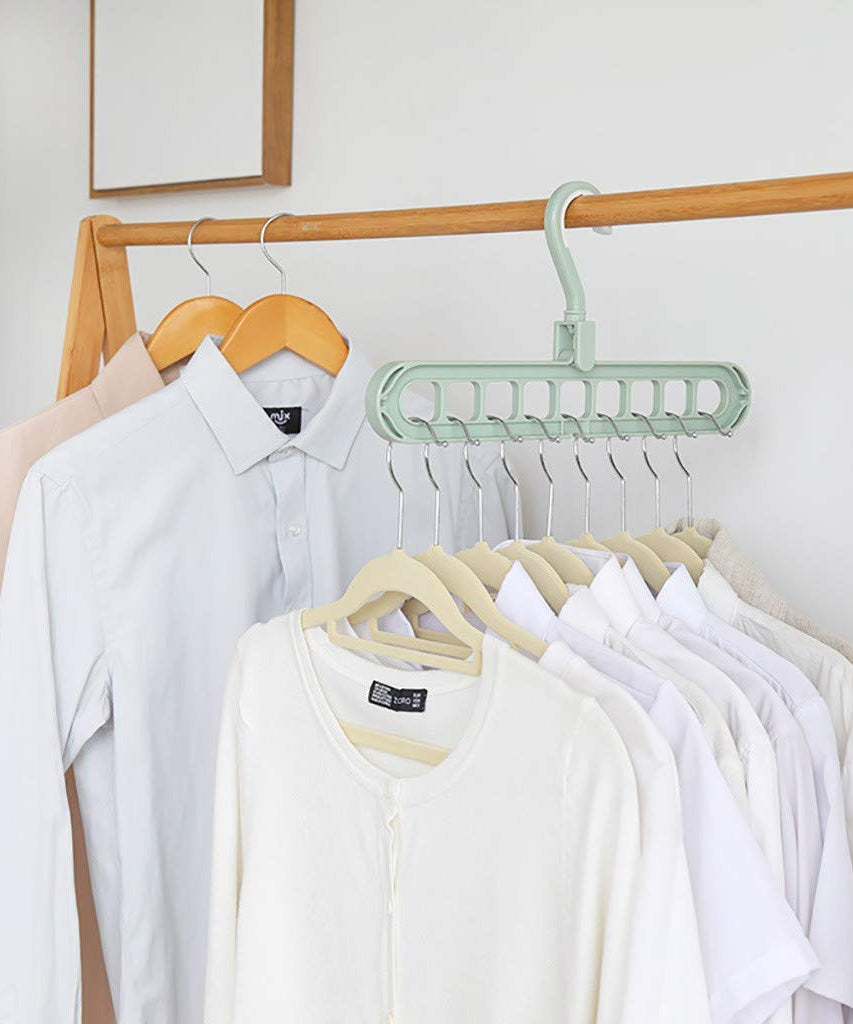 Multiple plastic wardrobe hangers with nine holes for versatile use.