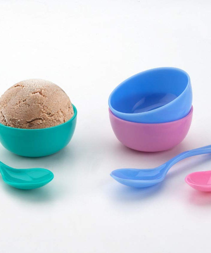 Snack set components laid out together: spoon, bowl, and dish.