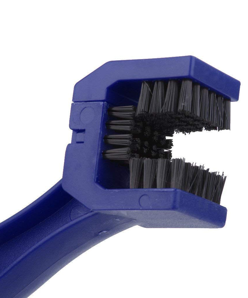 Motorbike chain cleaner tool in use on a bike chain