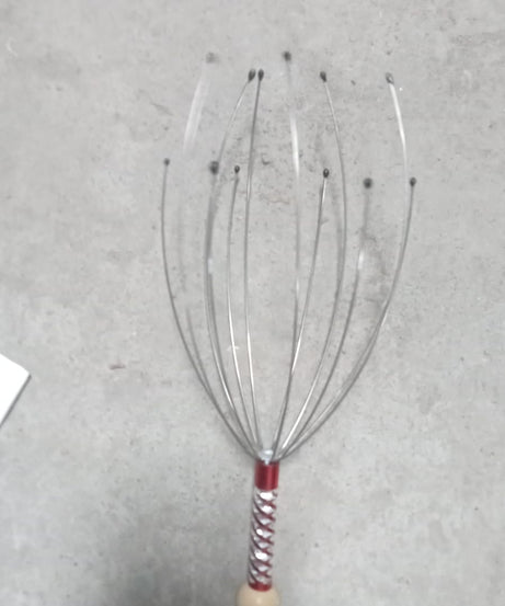 Handheld scalp massager for effective stress relief and relaxation.