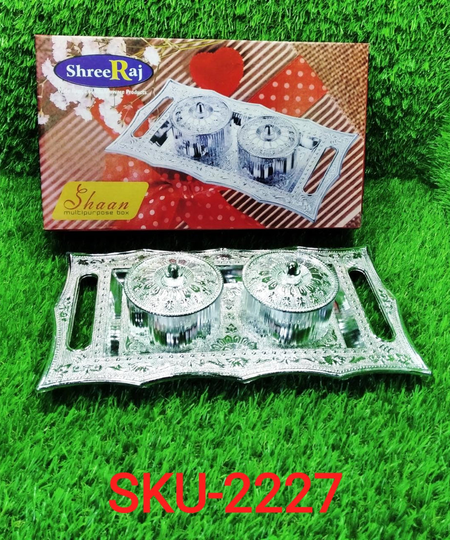 Decorative tray with lid for storage and serving.