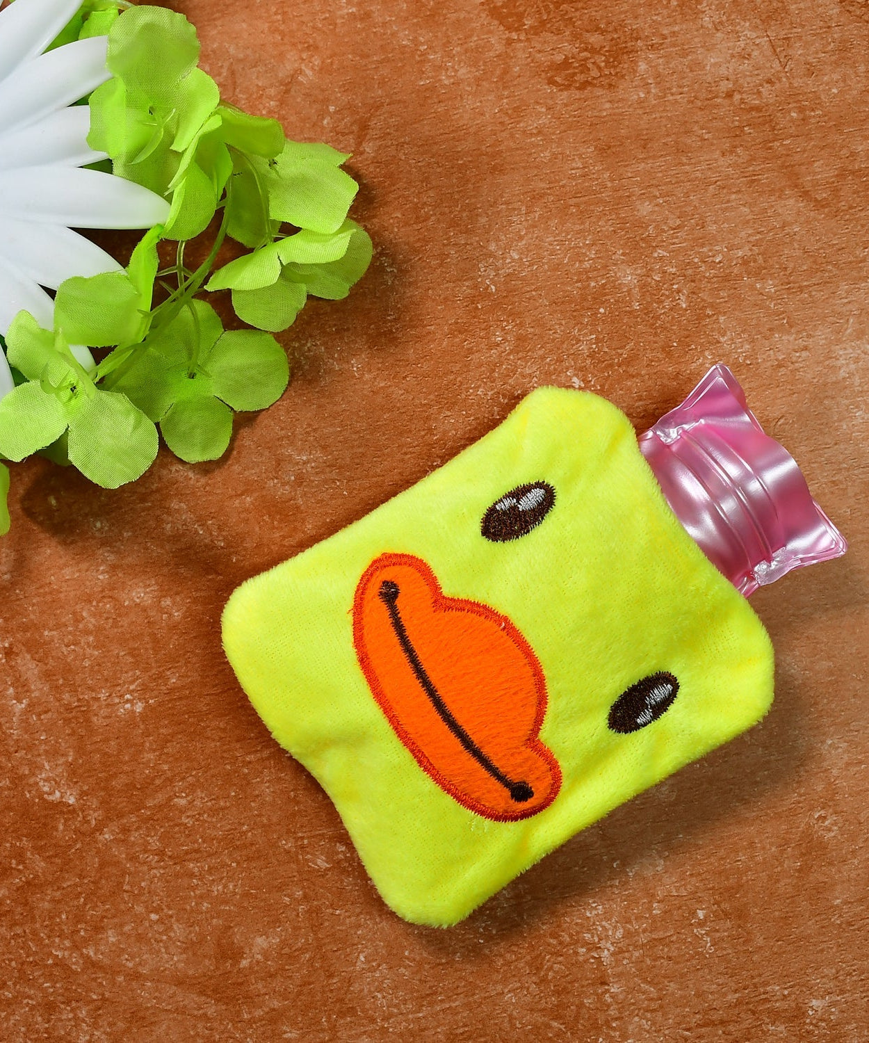 Yellow duck hot water bag with cover for pain relief and warming