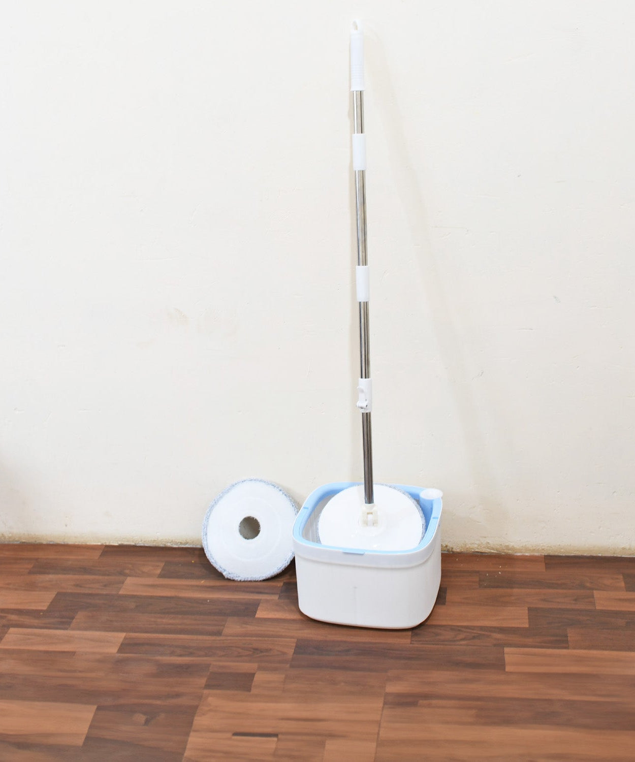 Water spin mop with separate bucket for dirty and clean water.