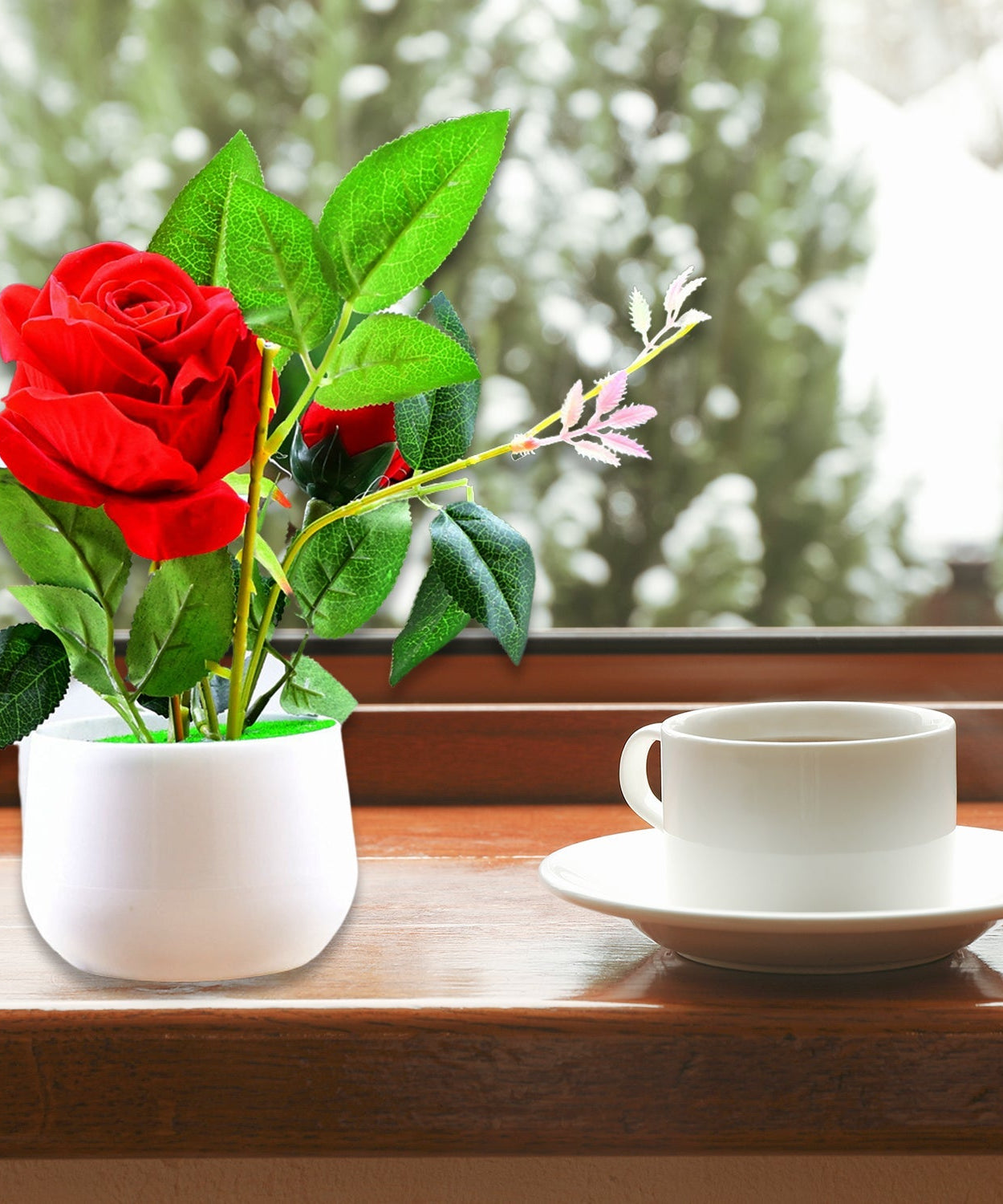 Artificial rose plant in a decorative pot