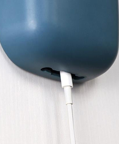 Wall-mounted charging holder.