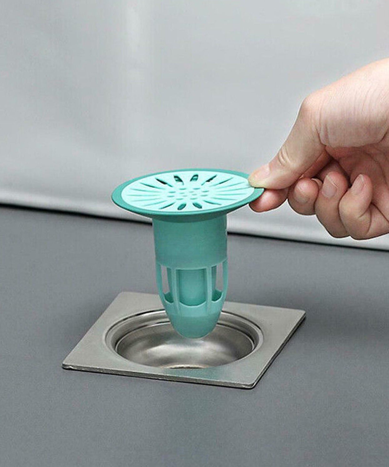 Anti-odor and insect-proof silicone drain stopper, traps hair and debris for kitchen and bathroom.