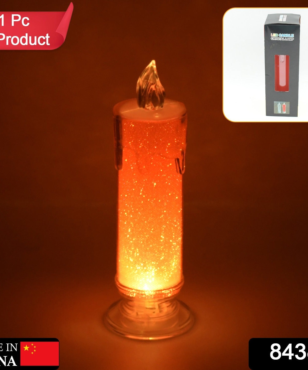 Close-up of red flameless candle, showcasing its transparent design and decorative flame effect.