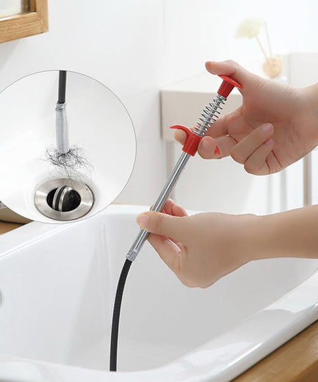 Close-up of multifunctional drainage cleaner showing claw for block removal.