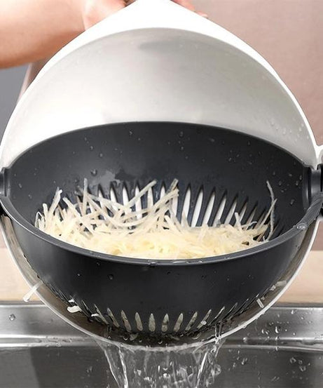 Cutter with vegetable slices being drained in the rotating basket