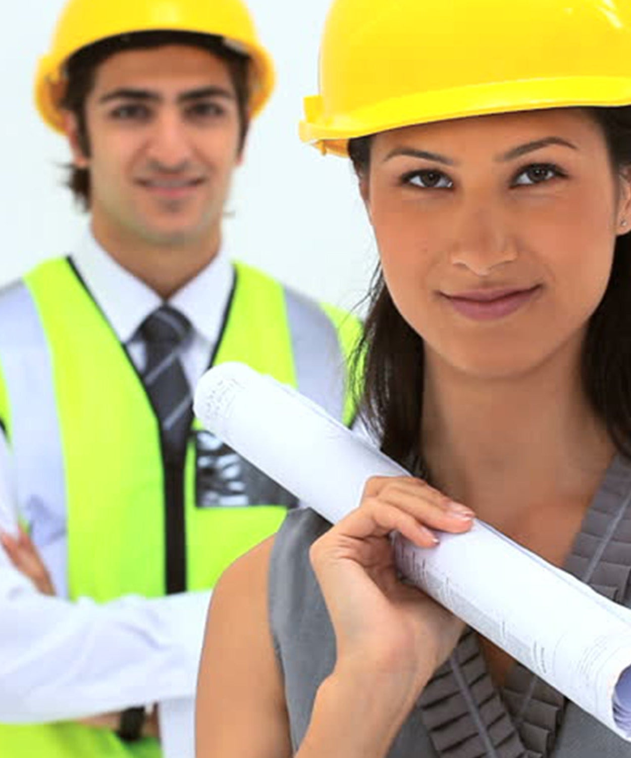 Yellow hard hat made of robust plastic, suitable for construction environments.