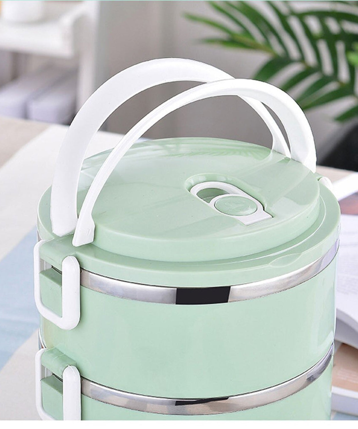 Two layer stainless steel lunch box for keeping food hot.