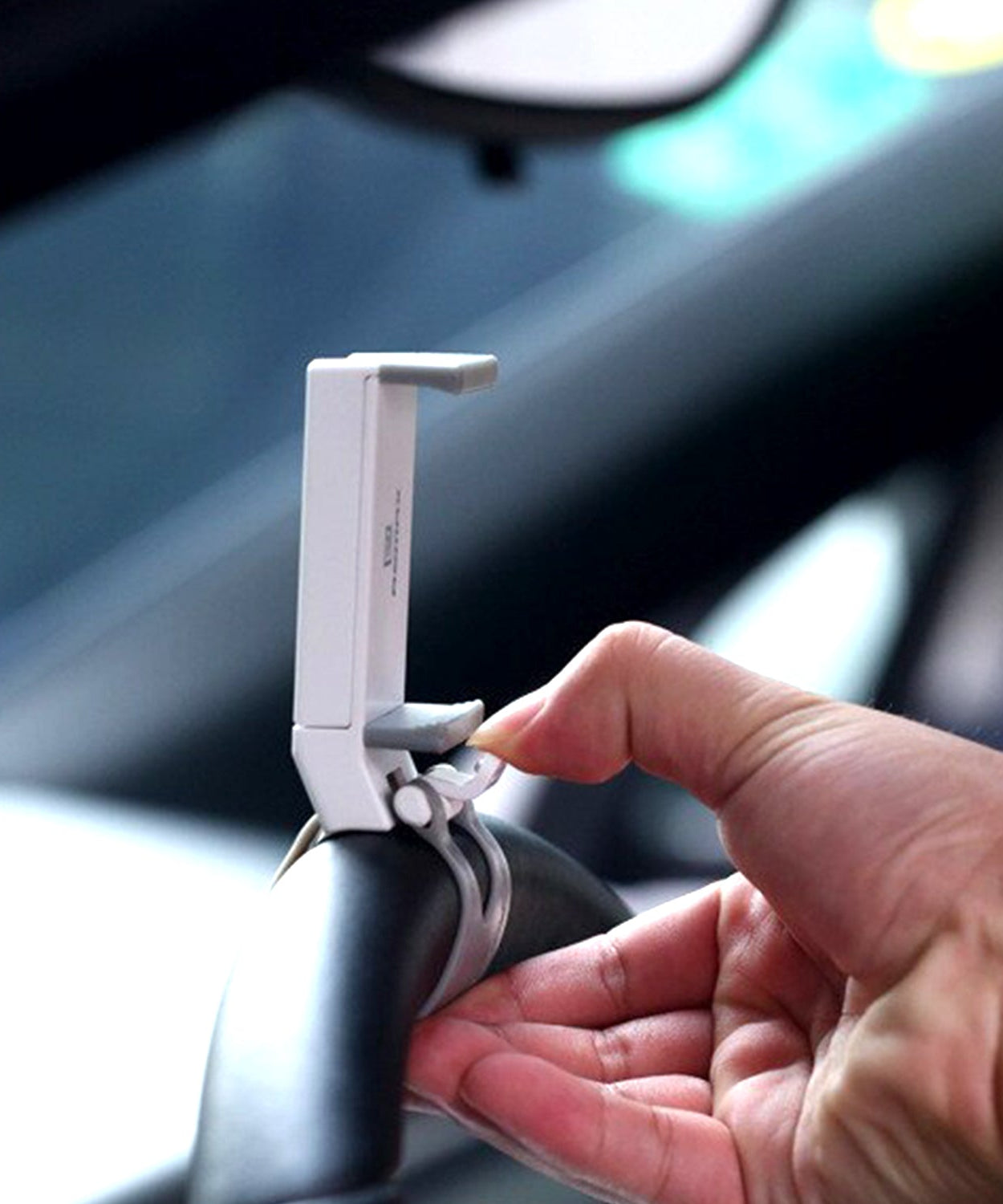 Secure mobile holder attached to steering wheel