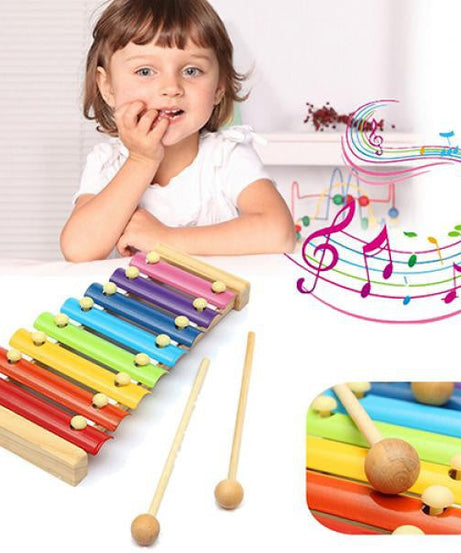 Colorful wooden xylophone with multicolored bars and mallet