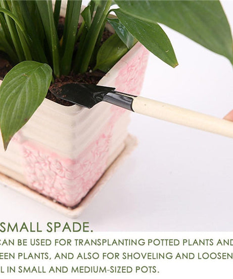 Kid's gardening trowel, shovel, and rake set