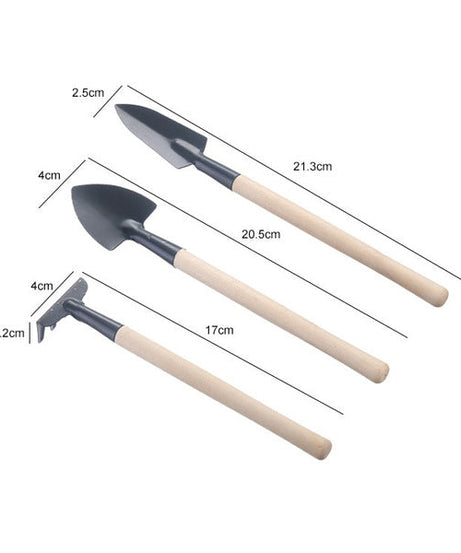 Set of kid's garden tools: trowel, shovel, rake