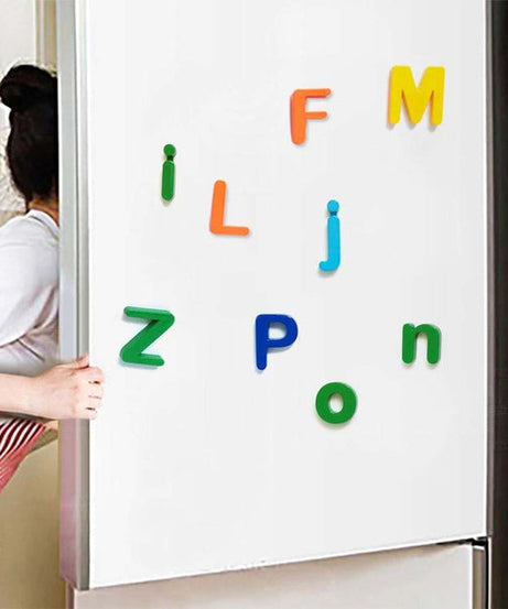 Colorful magnetic letters on a whiteboard