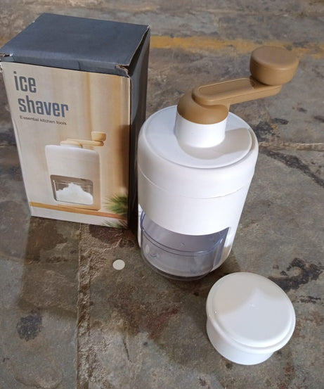 Small ice crusher for homemade shaved ice, manual operation.
