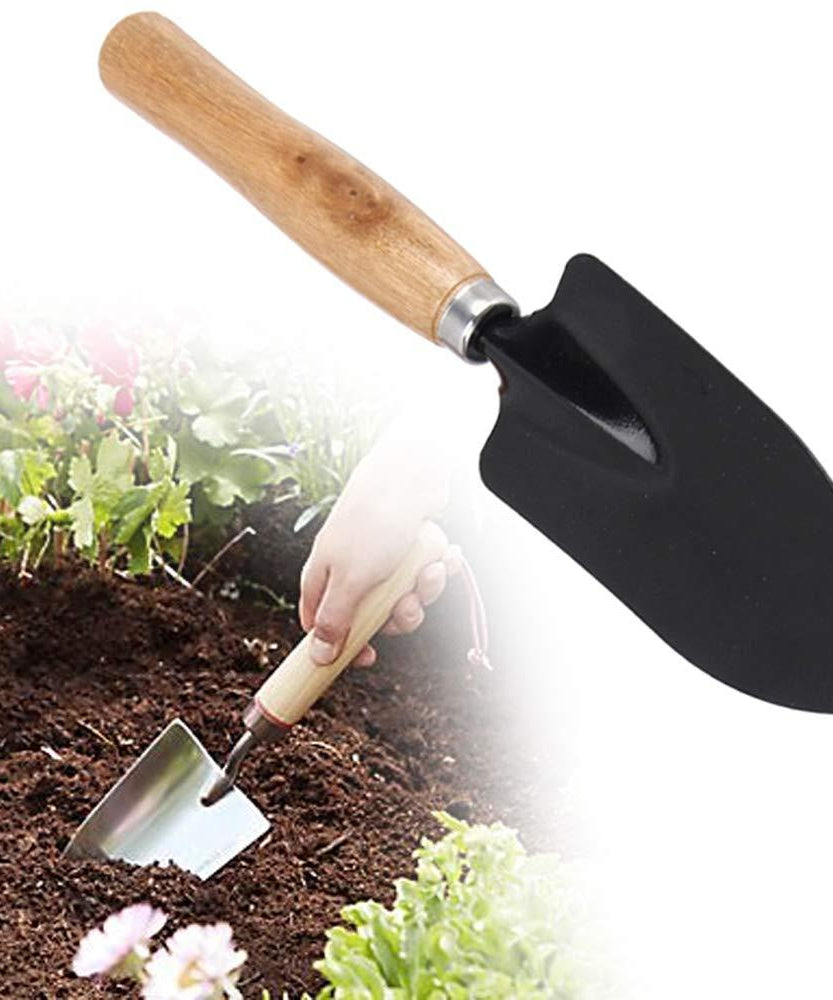 Hand trowel for digging, steel with black handle.