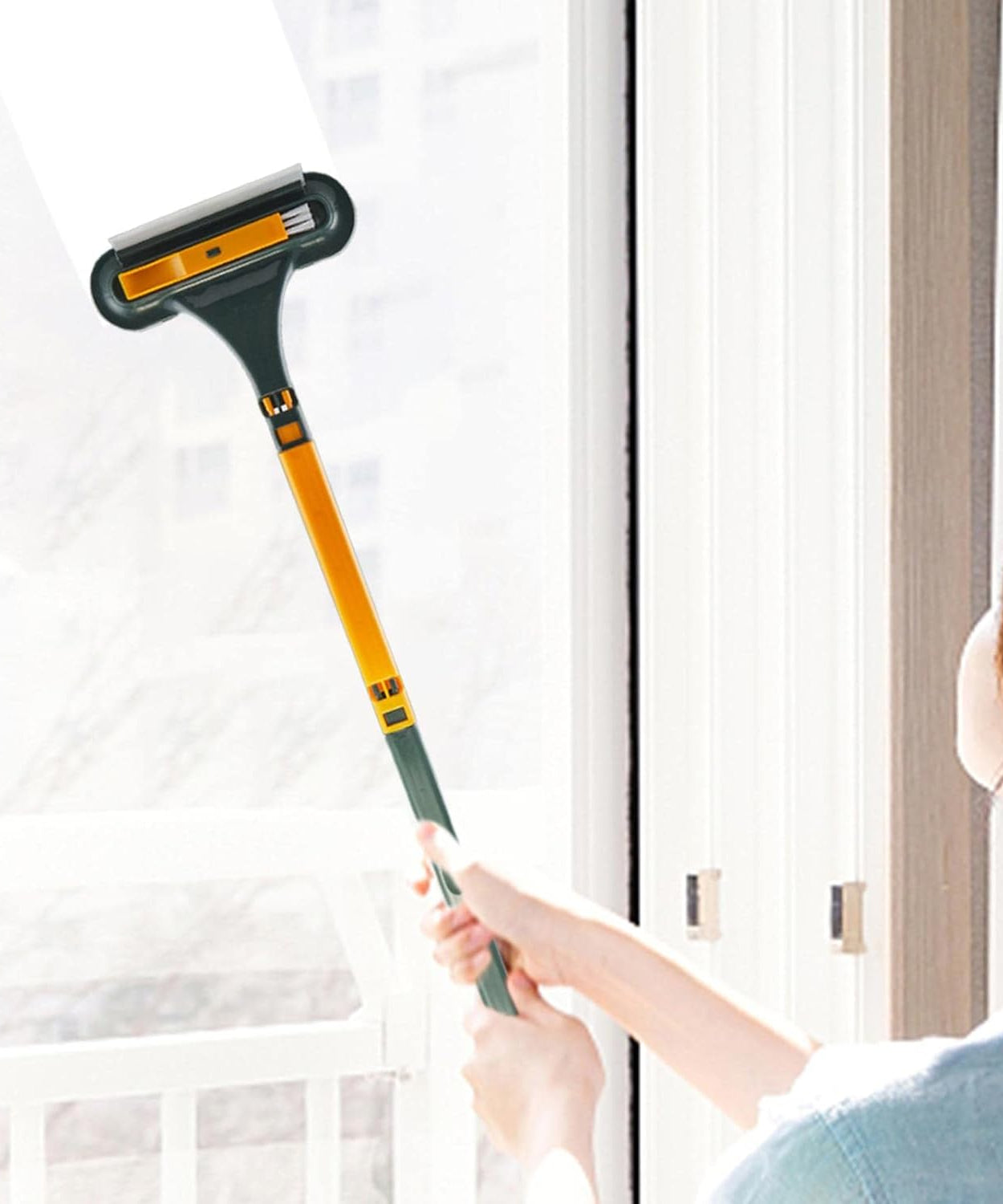 Window screen cleaner brush with handle, ideal for cleaning mesh and glass surfaces.