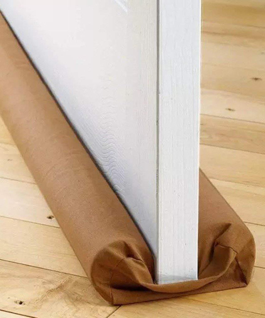 Draft stopper installed at the base of a door