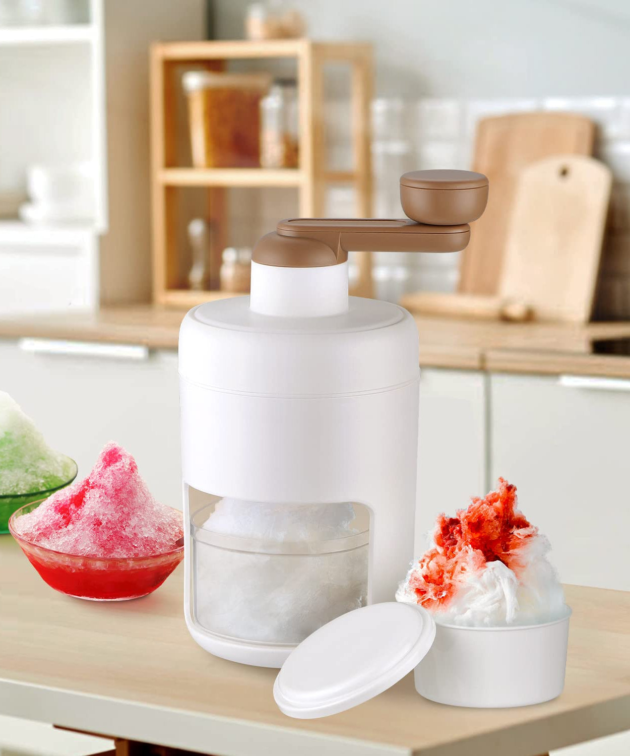 Hand-cranked ice crusher and shaved ice machine for making smoothies.