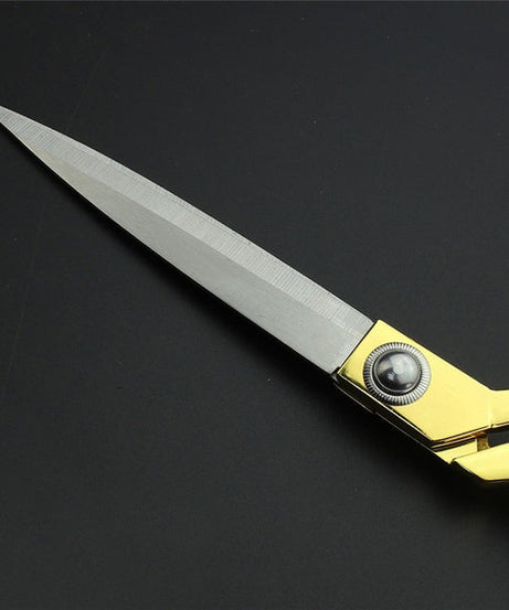 Gold-plated professional scissors for seamless fabric cuts.